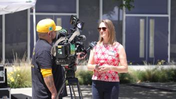 Janna Tolla talking to local news interview about the Memorial Day Ceremony.jpg