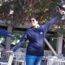 Student modeling Aggie sweatshirt