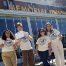 4 students in MU Open House t-shirts in front of the Memorial Union